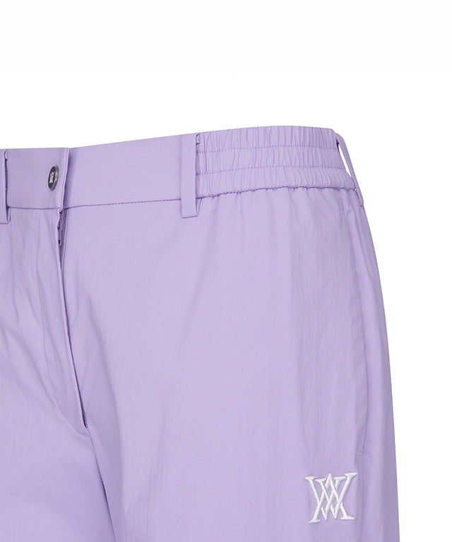 Lavender ANEW Golf Women Ventilation Slim Jogger Long Pants showcasing stylish design and comfortable fit.